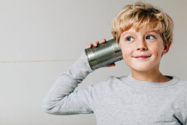 Boy listens to Tin Can Phone 1.jpg
