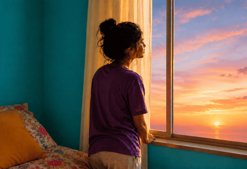 Woman looking out window.png